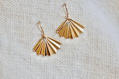 "Art Deco Fan Earrings. Simple 14K Gold Filled Dainty Dangles. Minimalist everyday jewelry staples. Small fan drops. Classic or lever back ear wires. Dainty and sweet jewelry. These simple and classic Art Deco fan earrings will be your daily go-to's. Small 14K gold filled folded fans are suspended from high quality 14K ear wires. Choose classic or lever back ear wires at checkout.  Dainty and lightweight earrings measure just 7/8\" long (including the ear wire). Earrings arrive packaged for gift Gold Lever Back Earrings For Gift, Delicate Gold Jewelry With French Hook, Gold 14k Lever Back Jewelry, Gold French Hook Earrings 14k Gold Filled, Gold 14k French Hook Earrings, Dainty Gold Earrings With Lever Back Ear Wires, Minimalist 14k Gold Earrings With French Hook, 14k Gold Lever Back Earrings, 14k Gold Earrings With French Hook