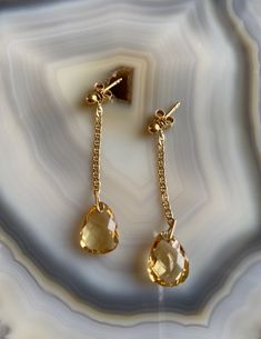 Delicate, feminine and so gorgeous! This is an 18k Gold Filled Earrings featuring a beautiful polished Citrine gemstone. You can see how clear is this stone’s cut. Amazing! Citrine is a great gem to wear to increase motivation! You will love how it will match a lot of your outfits! Product Details: . Size: 2” . Material: 18k Gold Filled 14k Gold Teardrop Jewelry With Gemstone Accents, Elegant Citrine Gemstones With Gemstone Accents, Elegant Teardrop Gemstones For Anniversary, Elegant Drop Gemstone, Elegant Formal Citrine Earrings, Elegant Citrine Gemstones For Wedding, Elegant Faceted Gemstones For Formal Occasions, Dainty Sterling Silver Earrings With Gemstone Accents, Timeless Topaz Jewelry Gift