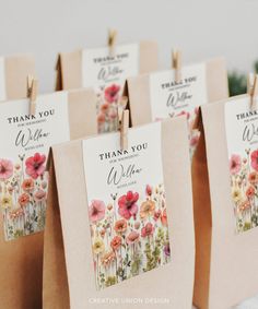 small bags with thank you cards attached to them