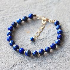 Natural Blue Lapis Lazuli Semi Precious Beaded Gemstone Gold Filled Bracelet Gold or Silver - Etsy Sapphire Lapis Lazuli Bracelets With Round Beads, Elegant Blue Hand-strung Crystal Bracelet, Sapphire Gemstone Beads Bracelet In Lapis Lazuli, Sapphire Lapis Lazuli Beaded Bracelets, Sapphire Lapis Lazuli Gemstone Beaded Bracelets, Sapphire Lapis Lazuli Beaded Bracelet With Natural Stones, Gold Bracelets With Lapis Lazuli And Natural Stones, Sapphire Lapis Lazuli Jewelry With Faceted Details, Elegant Blue Faceted Crystal Bracelet