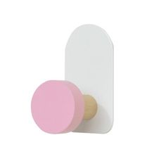 a white and pink wall hook with a wooden knob on the end, against a white background