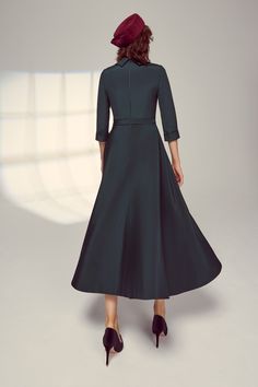 An elegant full skirted dress, the Silk Cowl Neck Riding Dress in Forest is softly tailored from our signature high quality Italian silk crepe, which has a wonderful fluidity, weight and drape. A rounded cowl neck collar falls beautifully to expose the décolletage and frame the face. Featuring 3/4 length sleeves with a fixed cuff and a full skirt which dips down at the back, this dress has a centre-back invisible zip for step-in ease, and is fully lined in silk. Style with soft grey, navy, or me Elegant Fit And Flare A-line Evening Dress, Formal A-line Tea Length Dress With Pleated Bodice, Chic A-line Tea Length Formal Dress, Workwear A-line Maxi Dress With Fitted Bodice, Elegant Fitted A-line Tea Length Dress, Elegant A-line Tea Length Cocktail Dress, Elegant A-line Maxi Dress For Formal Occasions, Elegant A-line Maxi Dress With Fitted Bodice, Elegant A-line Dresses With Pleated Waist