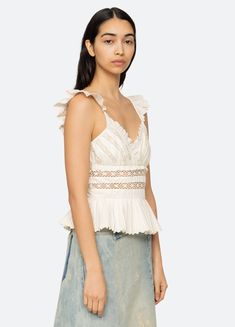 The Antonina tank top features flutter sleeves, lace inserts, ruffle detailing and pleated trim hem. Details: 100% polyester invisible back zipper designed for a slimmer fit style #PF24-007 model is 5'10'' and wearing a size 4 Denim Outerwear, Lace Insert, Overall Dress, Engineered Garments, Summer Accessories, Outerwear Sweater, Bottom Clothes, Fit Style, Flutter Sleeves