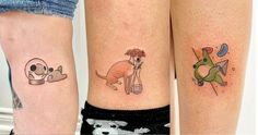 two people with matching tattoos on their legs, one has a dog and the other has a cat