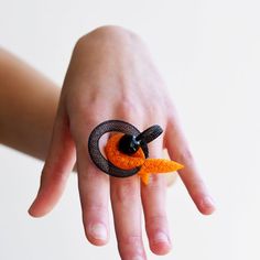 Hey, I found this really awesome Etsy listing at https://www.etsy.com/listing/1019786200/black-fascinator-ring-statement-art-ring Unique Black Rings For Halloween, Unique Black Halloween Rings, Black Snake Ring Gift, Adjustable Unique Snake Ring, Handmade Orange Ring Jewelry, Unique Party Jewelry Ring, Unique Black Jewelry For Party, Unique Party Ring Jewelry, Handmade Adjustable Snake Ring