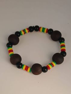 Our beautiful unisex Rasta African Bead Bracelets. is crafted from wood,super elegant, fashionable and lightweight. They will complete your look instantly. Please note: there is only one bracelet in a bag, either black or brown.  Inbox me colour you want. Traditional Black Bracelets With Wooden Beads, Traditional Black Bracelet With Wooden Beads, Traditional Wooden Bracelets With Round Beads, Traditional Wood Bracelets With Round Beads, Traditional Wooden Bracelet With Round Beads, Bohemian Wooden Bead Bracelets, Handmade Wooden Beaded Bracelets, Traditional Adjustable Wooden Beads Stretch Bracelet, Bohemian Adjustable Wooden Beaded Bracelets