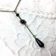 A romantic black Y-shaped drop design cabochon lariat necklace in a nostalgic setting with an antique brass chain. The cabochon is 5mm. The teardrop is 12mm. The beads are 3/4mm czech glass. The lariat drop is 2.55 inches / 6.5 cm. The necklace length is 16.50 inches, 40.6 cm, but you can also make a choice in the menu. ----------------------------------------------------- I always send the items gift wrapped and with care in 1 day. All items are lead and nickel-free. Let me know if you have any questions. I will answer them as soon as possible. Thank you for visiting and happy Etsy shopping! For more handmade vintage style jewelry please visit my shop: http://www.byoubijoux.etsy.com Vintage Lariat Necklace With Adjustable Chain For Gifts, Elegant Black Jewelry With Antique Finish, Handmade Vintage Long Drop Jewelry, Vintage Adjustable Lariat Necklace As Gift, Elegant Antique Finish Adjustable Necklace, Vintage Black Lariat Jewelry, Elegant Brass Lariat Necklace As Gift, Elegant Bronze Wire Wrapped Necklaces, Elegant Adjustable Necklace With Vintage Charm