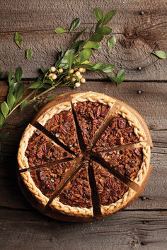 A chocolate bourbon pecan pie with a braided crust on a wood table Chocolate Bourbon Pecan Pie, Bourbon Pecan Pie, Chocolate Bourbon, Pie Plate, Pecan Pie, Mini Chocolate Chips, Corn Syrup, Pie Crust, Melted Butter