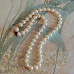 This is a vintage, original box any pamphlets, Majorica pearl necklace. The clasp is marked and it tested positive for sterling silver. I think this is from 1985, according to the pamphlet. All sales are final. The pearls measure 8 mm across. The necklace is 18 inches in length.  If you have a wish list or are looking for something specific, please ask. I may have exactly what you are looking for. As always please convo me with any questions or concerns regarding this item or with any international shipping questions. Unfortunately I do not accept returns or grant refunds. All shipping fees include handling fees. If you would like to combine shipping costs for more than one item, I would be happy to do so if you convo me before purchase. Purchasing my item means you have read, understood a Vintage Pearl White Jewelry For Anniversary, Vintage Pearl Necklace For Gift, Vintage Single Strand Pearl Necklace, Vintage Pearl White Jewelry Gift, Vintage Pearl White Pearl Necklace Gift, Vintage Pearl White Jewelry As Gift, Vintage Pearl White Jewelry For Gift, Vintage Pearl White Round Bead Necklaces, Vintage Pearl White Pearl Necklace For Gift