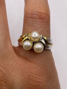 Vintage white cultured pearl  Sterling silver with gold setting   Re sizing has a $20 jeweler's fee. All rings are shipped in a nice gift box.   Check out our over a THOUSAND great reviews Engraving is $4 per letter and is not always perfect depending on the piece. It can take a few days if the jeweler is busy. This is payable to Paypal Judithsltd@gmail.com 14k Stamped Pearl Ring As Gift, Classic White Pearl Ring For Gifts, White Pearl Ring Stamped 14k As Gift, White 14k Stamped Pearl Ring For Gift, White Gold Pearl Ring Stamped 14k For Gift, 14k White Gold Pearl Ring Gift, White Hallmarked Pearl Ring For Anniversary, White Hallmarked Pearl Anniversary Ring, Luxury 14k Stamped Pearl Ring As Gift