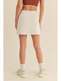 Your new go to tennis skirt is here and ready to be worn for all of your fave Summer activities! - Features a smoothing shape high waist as well as built in short lining. - Fits true to size | Model is 5'9" wearing a size Small - INSEAM S - 14.25" M - 14.5" L - 15" - 75%, Nylon, 25% Spandex *due to screens / filters colors may vary slightly to photos* Casual Spring Tennis Skirt With Built-in Shorts, Spring Tennis Mini Skirt In Solid Color, Tennis Mini Pleated Skirt, Solid High-waist Tennis Skirt For Spring, Spring High-waisted Tennis Skirt, Spring Tennis Skirt With Stretch, Sporty Fitted Mini Tennis Skirt, Fitted Tennis Skort For Spring, Sporty High Waist Pleated Tennis Skirt