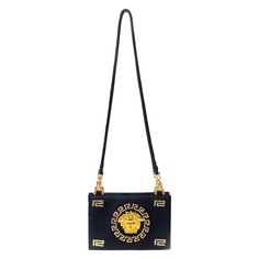 Made of gorgeous blue silk satin and embellished bag with a large iconic gold Medusa logo, this bag is classically Versace. Gold and crystal Greek Key embellishments are seen throughout the bag, including on the zipper, which is constructed of a Greek Key and Medusa pull. The bag has satin silk rope straps and a top zipper. This bag is a show-stopper designed by Gianni Versace for the iconic 'Miss S&M' F/W 1992 collection. Approximate measurements: Height: 6.5" Width: 9" Depth: 2" Handle Drop: 1 Timeless Bags, Versace Gold, Satin Noir, Versace Couture, Versace Brand, Gold Rhinestone, Greek Key, Black Tote, Gianni Versace