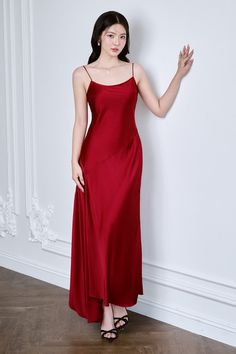 Made with luxurious mulberry silk, this ankle-length dress features an elegant asymmetric scoop neck. The smooth, soft fabric and flattering silhouette will make you feel like a work of art. Perfect for a sophisticated night out. Elegant Red Asymmetrical Maxi Dress, Elegant Asymmetrical Solid Maxi Dress, Elegant Asymmetrical Solid Color Maxi Dress, Elegant Red Asymmetrical Dress, Elegant Red Bias Cut Slip Dress, Formal Red Slip Dress With Bias Cut, Red Bias Cut Slip Dress For Formal Occasions, Solid Silk Bias Cut Maxi Dress, Solid Silk Bias-cut Maxi Dress