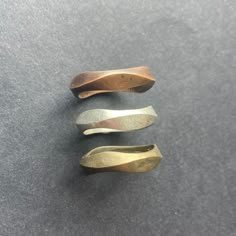 a simple curvy band.  available in bronze, copper, silver or gold.  prices will reflect the material choice.  rings can be polished or left satin as above.  all precious metals will be hallmarked (silver & gold)  items may differ slightly from pictures above.  pictures show different metal choices.  one ring per payment. Bronze Rings, Hollow Form Ring, Cast Jewelry, Mini Skirts With Tights, Cast Rings, Rough Jewelry, Curve Ring, Unique Silver Rings, Iron Jewelry