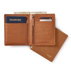 Crafted from the same rich pebbled leather as the rest of our best selling Harvey collection, this travel wallet makes a great gift for the for the jetsetter. The taller profile is designed to fit both a passport and various sizes of paper currency, with a secure zipper pocket for coins and slots for multiple cards. Make a memorable gift by adding a sophisticated monogram.    4.75"w x 5.75"h x 0.5"d  Pebbled leather with antiqued brass hardware.  Imported.  Monogramming is foil debossed. Travel Wallets With Coin Pocket, Modern Brown Trifold Wallet For Travel, Luxury Bifold Card Holder For Travel, Classic Travel Accessories With Rfid Blocking For Everyday, Brown Travel Wallet With Zipper Closure, Modern Travel Wallets With Zipper Closure, Classic Rfid Blocking Travel Accessories For Daily Use, Luxury Brown Card Holder For Travel, Luxury Brown Travel Card Holder