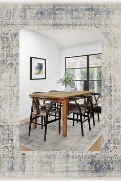 a dining room table and chairs in front of a window with an old rug on the floor