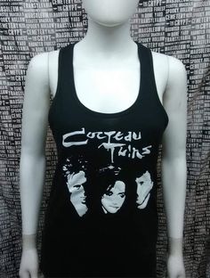 This is a black sleeveless long Cocteau Twins tank top with racer back. This has a Cocteau Twins image screen printed on the front. 60% cotton/ 40% polyesterThese are handmade screenprinted and slightly vary from the photo. Please feel free to email me any questions. Thanks for looking.Due to an influx of incorrect addresses if a package is returned,  you must pay the shipping cost to resend the item to you.I do not do exchanges and I do not take returns unless the item is damaged. I thoroughly Cocteau Twins, Long Tank Top, Black Cropped Tank, Black Crop Top Tank, Long Tank Tops, Black Goth, Long Tank, Sister Shirts, Post Punk