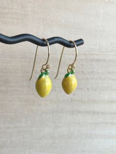 These dainty lemon earrings are made of the following: (1) Gold plated yellow epoxy lemon charm (13.5 x 7.5 mm) (2) Gold plated or 14KGF earring hooks ✏️ Please choose your desired earring hooks 🍋OTHER STYLE 🍋 Stud Earrings -> https://www.etsy.com/listing/905059870 🍋NECKLACE 🍋 → https://www.etsy.com/listing/597533538 🍋 LEMON SLICE EARRINGS 🍋 -> https://www.etsy.com/listing/720904838 【BEFORE PURCHASE, PLEASE NOTE THE FOLLOWINGS】 ☆ VAT, GST and any other taxes from your country are NOT Yellow Enamel Round Jewelry, Yellow Enamel Jewelry For Gift, Yellow Gold Enamel Dangle Earrings, Yellow Gold Enamel Earrings As Gift, Yellow Gold Enamel Dangle Jewelry, Handmade Lemon Color Dangle Jewelry, Nickel-free Yellow Gold Enamel Earrings, Classic Yellow Earrings For Gift, Classic Yellow Earrings As Gift