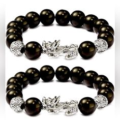 Original Feng Shui Black Obsidian Beads. The Fierce Beast In Chinese Folk Mythology Sand Gold Brings Wealth, Good Luck, And Fortune To The Wearer. The Beautiful Bracelet Is For Men And Women. Buy 2 For $18.00 Or Buy 4 For $33.00 Same Color Or Mix. Just Leave A Message On How You Want It Mix. Thank You! Black 8mm Beads For Gifts, Elegant Silver Obsidian Bracelets, Elegant Black Jewelry With 8mm Beads, Black Spiritual Bracelets With Silver Beads, Silver Obsidian Beaded Bracelets, Silver Obsidian Beaded Bracelets With Round Beads, Spiritual Black Bracelets With Silver Beads, Adjustable Silver Obsidian Beaded Bracelets, Black Onyx Jewelry With Silver Beads