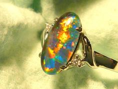 "When I first started in the Opal Trade 50 odd years ago, the 12 x 6 mm Oval Shaped stone was extremely popular. The long ,narrow, Oval shape lent itself perfectly to Pendants, Drop Earrings but particularly for Ring designs. The shape naturally follows the line of the finger  & looks elegant despite it's size, compared to rings featuring wider stones. In the last few decades 12 x 6mm Oval has virtually disappeared from the Opal Jewellery market & is rarely seen, try Googling it. I've decided to Jewellery Market, Opal Jewellery, Jewellery Marketing, Opal Ring Gold, Oval Rings, Opal Ring, Australian Opal, Diamond Design, Opal Jewelry