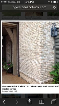 an image of a brick building with shutters on it