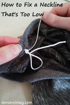 someone is stitching something on top of a sweater