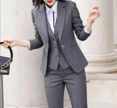 This unique ladies suit is designed with high quality wool material that guarantees durability and comfort. It is suitable for all kinds of occasion and it can be worn all year round. It comes in 3 pieces ( Jacket + Vest + pant) the blazer can also be worn with any kind of trouser or jeans  For custom orders, Please feel free to start a  conversation for further enquires. Your satisfaction is our priority Womens Suit Accessories, Female Pant Suit Wedding, Female 3 Piece Suit, 3 Pieces Suit Woman, Womens Waistcoat Suit, Women’s 3 Piece Suit, Fall Blazer For Business Meetings, Fall Office Lady Blazer For Business Meetings, Tailored Winter Pantsuit For Business Casual