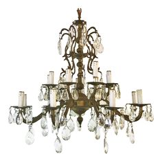 an antique chandelier with crystal drops hanging from it