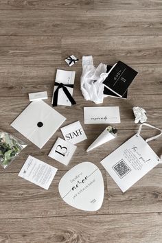 wedding stationery laid out on a wooden floor