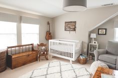 a baby's room with a crib, rocking chair, and other furniture