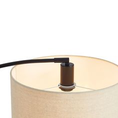 a lamp that is on top of a table with a black cord attached to it