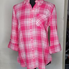 This Tommy Hilfiger Women's Top Features A Trendy Loose Fitting Plaid Pattern In Azalea Pink And White, With A Collared Neckline And Button-Down Closure. The Long Sleeves Can Be Rolled Up And Secured With Tabs For A More Casual Look. The Lightweight Flannel Fabric Is Made Of 100% Cotton For Comfort In The Fall And Winter Seasons. The Blouse Is A Size Small And Has A Regular Fit. It Also Includes Accents Of Tommy Hilfiger's Logo On The Buttons. This Colorful And Classic Shirt Is Perfect For Trave Casual Plaid Tops For Daywear, Tommy Hilfiger Long Sleeve Tops For Spring, Tommy Hilfiger Long Sleeve Blouse For Spring, Casual Tommy Hilfiger Blouse For Spring, Tommy Hilfiger Casual Blouse For Spring, Tommy Hilfiger Long Sleeve Blouse, Tommy Hilfiger Casual Cotton Blouse, Tommy Hilfiger Casual Spring Blouse, Tommy Hilfiger Relaxed Fit Summer Shirt