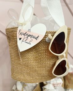 Straw mini bucket handbag! With your purchase you will receive: 1 straw bucket hand bag! 1 pair of heart tortoise sunglasses 1 personalized heart tag I will also include tissue paper inside each bag. Bags have a light pink handle and snaps closed! Size- 30*20*12 cm Trendy White Bucket Bag As Gift, Heart-shaped Summer Bags For Gifts, Heart-shaped Summer Bag For Gifts, Summer White Bucket Bag Gift, White Bucket Bag As Summer Gift, Heart-shaped Summer Gift Bags, White Bucket Straw Bag As Gift, Heart-shaped Summer Bags For Everyday Use, Bridesmaid Bags