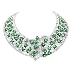 This captivating estate necklace is masterfully handcrafted in solid 18K white gold, weighing approximately 304.0 grams. The entire openwork lace pattern surface is embellished with emerald flowers and diamond buds and stems to produce this breath-taking floral spray neck adornment. Some 1580 sparkling round-faceted diamonds and 59 genuine baguette diamonds. All floral profiles are further enhanced with immaculately mille grained borders. Featuring a well-concealed tongue-in -groove security cla 1980 Jewelry, Necklace Art Deco, Gold Collar Necklace, Vintage Choker Necklace, Solitaire Diamond Pendant, Necklace Art, Lace Necklace, Diamond Jewelry Necklace, Diamond Choker