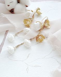 Delicate feminine wedding boho earrings. Earrings are fully handmade of gold-plated brass elements and hand-created foam flowers with tiny pearls in the middle, placed on the delicate chain. ❤️ earrings length 3.5 inches (9 cm) ❤️ earrings width 0.6 inch (1,5 cm) ❤️ earrings are very light weight and comfortable ❤️ made of gold-plated brass elements, tiny chain and hand crafted flowers ❤️ antiallergic nickel-free ear wire ❤️ different color option available - ask for details ❤️ ships within 5 da Delicate Gold Linear Earrings With Pearl Drop, Delicate Handmade Gold Pearl Earrings, Elegant Gold Flower Earrings For Celebration, Gold Dangle Chandelier Earrings For Wedding, Gold Chandelier Dangle Earrings For Wedding, Delicate Gold Earrings For Party, Yellow Gold Flower Earrings With Pearl Drop For Wedding, Dainty Gold Bridal Earrings With Ear Wire, Wedding Yellow Gold Flower Earrings With Pearl Drop