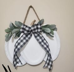 a white plate topped with a black and white bow