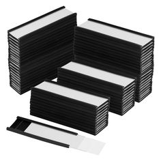 a stack of black and white business cards next to each other on a white background