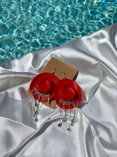 Fun trendy earrings to spice up any outfit. Red rhinestone fringe cowgirl hat earrings. Fun for holidays, like Christmas and more. Perfect cowgirl accessory for any occasion, last rodeo and more. Bachelorette party hit. Adjustable Western Jewelry For Party, Adjustable Western Style Party Jewelry, Adjustable Western Style Jewelry For Parties, Western Style Red Jewelry As Gift, Western Style Jewelry For Summer Gift, Western Style Summer Jewelry For Gift, Western Style Summer Jewelry As A Gift, Red Cowgirl Hat, Fringe Cowboy Hat