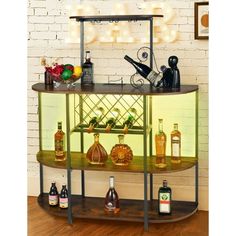 a shelf with liquor bottles on it in front of a brick wall and wooden floor