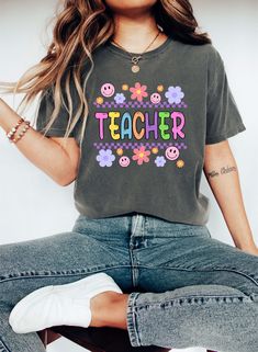 Comfort Colors Cute Teacher T-shirt, Kindergarten Teacher Shirt, First Day Of School Tee, Back To School T-shirt, Teacher Appreciation Gift Welcome to GUERILLA GRAPHICS,  Where creativity meets style in the form of printed apparel! Step into our world of edgy designs and bold statements with our curated collection of t-shirts, sweatshirts, and hoodies. Each garment is a canvas for self-expression, featuring eye-catching graphics that make a statement and stand out from the crowd. From urban-insp Fun T-shirt With Funny Print For Teacher Appreciation, Fun Graphic Print T-shirt For Teacher Appreciation, Trendy Screen Print Top For Teacher Appreciation, Retro Crew Neck T-shirt For Teacher Appreciation, Fun Crew Neck T-shirt With Letter Print, Fun Letter Print Crew Neck T-shirt, Fun Teacher Appreciation T-shirt With Graphic Print, Funny Multicolor Short Sleeve T-shirt, Graphic Tee With Screen Print For Teacher Appreciation