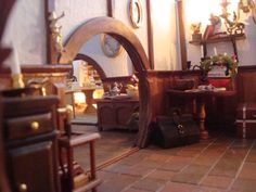 a living room filled with furniture and lots of mirrors