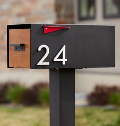 a mailbox with the number twenty four on it