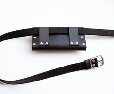 This slim leather waist bag is made of genuine black leather. It is perfect for phone, cards or other small items caring. On back side are two leather loops, so you can easily put it on a belt. Very stylish and perfect for festivals or traveling. You can use it also as small box clutch. You can choose this bag with or without the belt. Belt is 2,5 cm (~1 inch) wide. Waist circumference: 1. Waist 27.6 - 33.5 inch (70 - 85 cm); 2. Waist 31.5 - 37.4 inch (80 - 95 cm); 3. Waist 35.4 - 41.3 inch (90 Leather Tassel Keychain, Festival Belt, Slimmer Belt, Leather Waist Bag, Box Clutch, Tassel Keychain, Bum Bag, Leather Tassel, Waist Bag