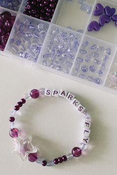 the beads are arranged in different shapes and sizes, along with letters that spell out sparkle