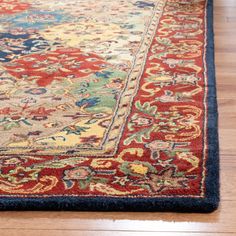 a red and blue rug on the floor