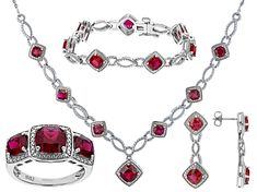 18.39ctw Square Cushion Lab Ruby And 0.02ctw Round White Diamond Rhodium Over Brass Necklace, Bracelet, Ring And Earring Jewelry Set. Necklace Measures Approximately 18"L x 0.99"W With Lobster Clasp Closure. Bracelet Measures Approximately 7.25" x 0.42"W With Hidden Box Clasp Closure And Safety Lock. Ring Measures Approximately 0.89"L x 0.44"W. Not Sizeable. Dangle Earrings Measure Approximately 1.25"L x 0.43"W With Pushbackings. Luxury Ruby Jewelry With Pave Setting, Formal Ruby Gemstones, Red Oval Jewelry With Pave Setting, Oval Red Jewelry With Pave Setting, Elegant Red Diamond Gemstones, Fine Jewelry Cubic Zirconia Gemstones For Formal Occasions, Formal Fine Jewelry With Cubic Zirconia Gemstones, Luxury Platinum Jewelry For Valentine's Day, Formal Ruby Jewelry With Pave Setting