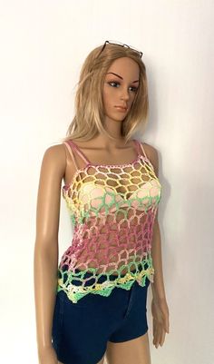 *FREE WORLDWIDE SHIPPING ON ALL ITEMS* Welcome to my shop, all items handmade by me with passion READY TO SHIP I designed and hand knit this beautiful lace camisole in a beautiful multicoloured yarn. Size: Sizes Xs -med (for chest size up to 36inches) US 4-8/UK8-12/EU36-40 This is a loosely knit vest so fits well :) Perfect over a bralette, crop top, beach wear or a vest and jeans. All items come with a gift card and ribbon attached ready to be given as a gift. ❤️Shipping times: This item is rea Stretch Tank Vest For Beach, Stretch Tank Vest For The Beach, Stretch Camisole Vest For Beach, Summer Beach Stretch Camisole, Multicolor Stretch Tank Top For The Beach, Fitted Multicolor Mesh Top For Summer, Spring Beach Sleeveless Mesh Top, Sleeveless Mesh Top For Spring Beach, Multicolor Stretch Crochet Top For Spring