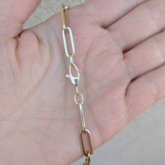 "Our best-selling 14k/18k gold rectangular flat paperclip chain in our biggest size: Extra Large. Choose from 14k/18k yellow, rose and white gold, as well as five different standard lengths (or contact us for a custom length). Layer two or three of our chains for the #neckmess look that is so hot right now! If you are interested in 18k gold, please contact us for a quote. Our rectangular flat paperclip chain comes in: Bracelet: https://etsy.me/2X6jSqM Extra Small: https://etsy.me/318xBN0 Small: 14k Gold Rectangular Paperclip Chain Bracelet, 14k Gold Paperclip Bracelet With Lobster Clasp, Formal Paperclip Bracelet With Lobster Clasp, Gold Rectangular Paperclip Bracelet With Lobster Clasp, Modern 14k Gold Paperclip Bracelet, Formal 14k Gold Paperclip Jewelry, 14k Gold Link Paperclip Bracelet, 14k Gold Paperclip Chain Jewelry, Modern 14k Gold Paperclip Bracelet With Lobster Clasp