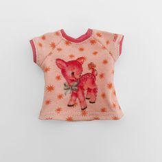 a pink t - shirt with an image of a baby deer on it