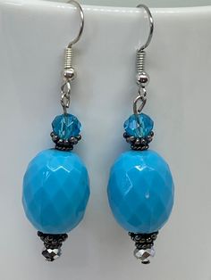 Beautiful faceted vintage beads were used to create these antique looking earrings.  The vintage beads are lightweight plastic. Blue Beaded Czech Glass Crystal Earrings, Blue Beaded Round Crystal Earrings, Blue Silver Beaded Drop Earrings, Blue Beaded Crystal Earrings With Round Beads, Blue Silver Beads Drop Earrings, Blue Czech Glass Crystal Earrings With Ear Wire, Blue Faceted Beaded Crystal Earrings, Blue Crystal Earrings With Faceted Beads, Blue Faceted Beads Earrings In Czech Glass